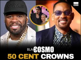 50 Cent smiling confidently at a public event wearing a black cap and jacket.