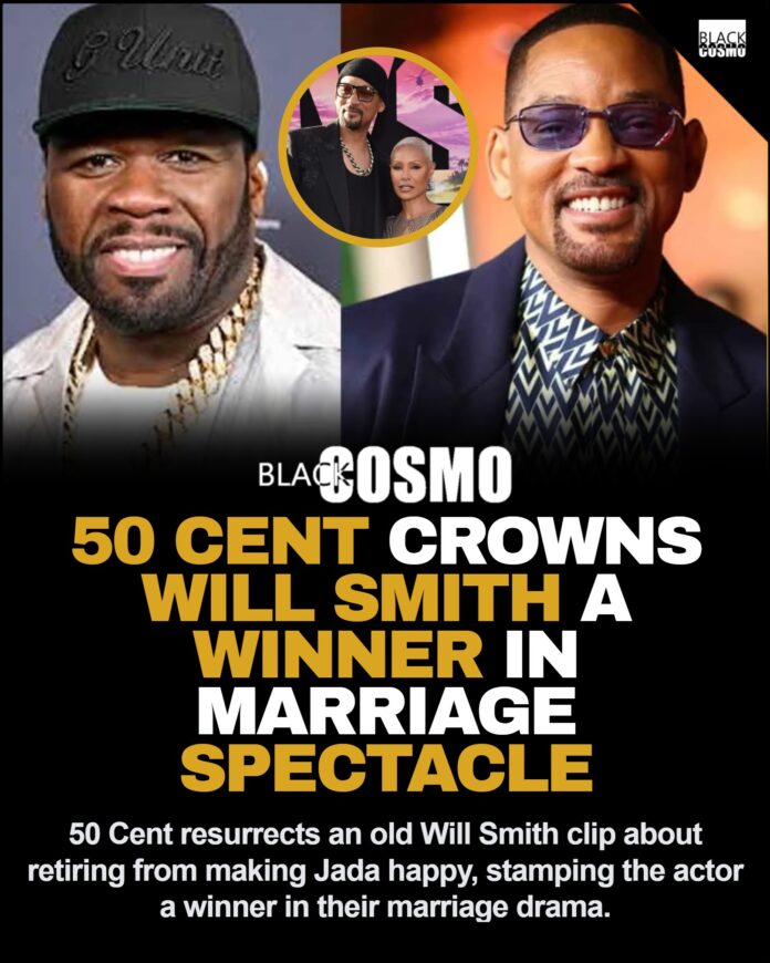 50 Cent Reignites Historic Feud With the Smiths Over Resurfaced Will Smith Clip 50 Cent smiling confidently at a public event wearing a black cap and jacket.