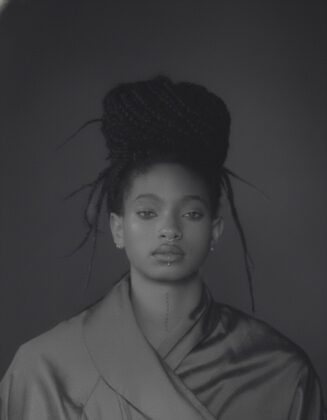 Willow Smith staring into the camera for the April 2026 cover of Hero Magazine USA, featuring complex braided hair styled by Braided Glory.