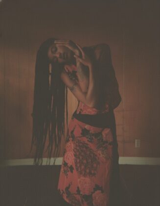 Willow Smith staring into the camera for the April 2026 cover of Hero Magazine USA, featuring complex braided hair styled by Braided Glory.