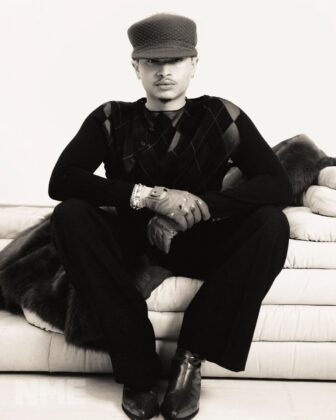 Destin Conrad posing for NME Magazine in a relaxed, high-fashion editorial spread with natural grooming and quiet luxury styling.