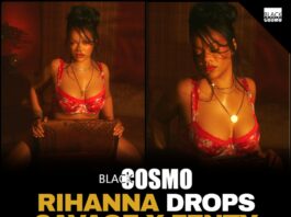 Rihanna reclining in a red floral two-piece Savage X Fenty lingerie set in a warm, dimly lit room.