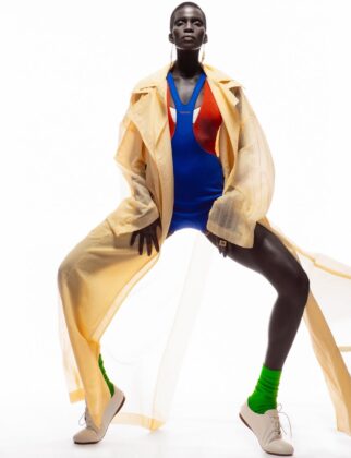 Achok Majak posing in a high-fashion, avant-garde editorial for Flaunt Magazine, featuring bold structural garments and sharp stiletto nails.