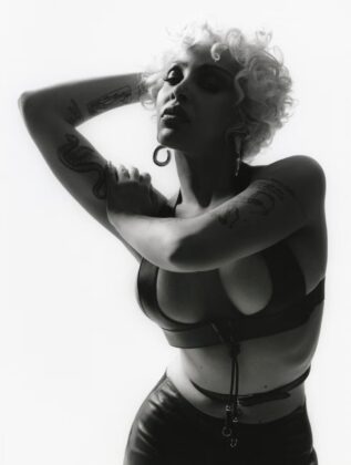 Doja Cat posing for the May 2026 cover of Elle UK in high-end fashion