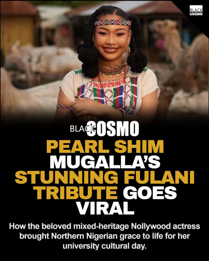 Pearl Shim Mugalla Honors Fulani Heritage Pearl Shim Mugalla posing in traditional Fulani attire with a camel in a dusty Sahel landscape