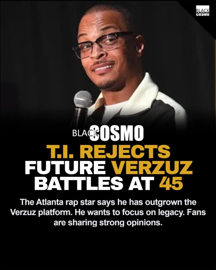 T.I. Says He Has No Time For Verzuz A portrait of Sade Adu resting her head on her hand in a white mohair sweater, reflecting timeless elegance.
