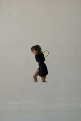 A professional portrait of Danielle Mills Walden, author of Scratching the Surface and former Wimbledon competitor.