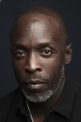A collage highlighting iconic Black television actors including Andre Braugher, Denzel Washington, and Michael Kenneth Williams.